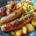 Rostbratwurst mit Kartoffel-Kohlrabi-Stampf und geschmolzenen Zwiebeln